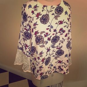 Printed top with lace bell sleeve.